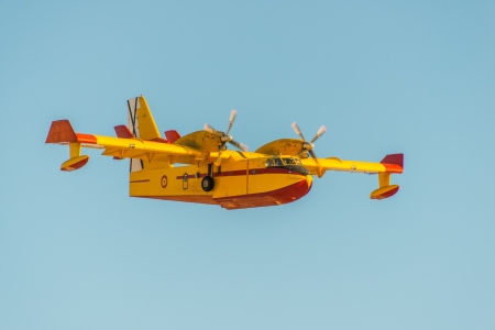 Firefighter airplane on sky background