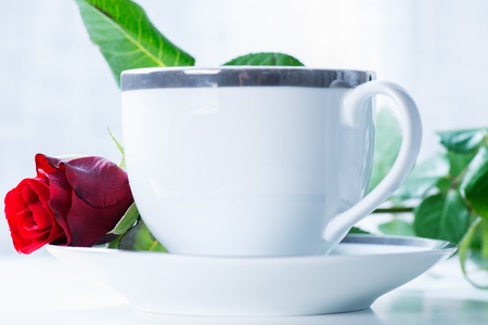 breakfast coffee cup with red roseの写真素材
