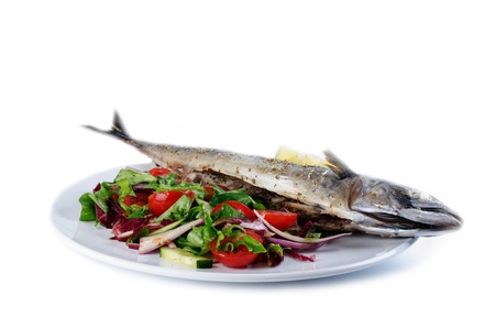 Mackarel fish with salad on the white plate. Studio shotの写真素材
