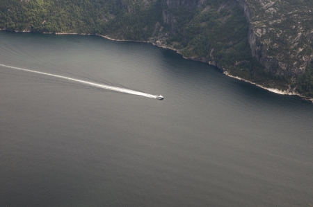 Boat in Lysefjord, view from Preikestolen cliff in Norwayの写真素材