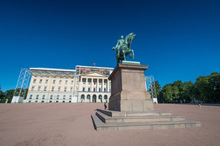 Royal palace in Slottsparken with statue of Karl Johan - Oslo - Norway being renovatedのeditorial素材