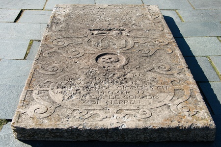 Old tombstone with skull and inscriptionのeditorial素材