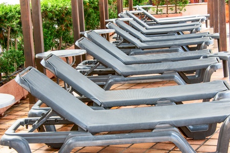 Poolside benches in lineの写真素材