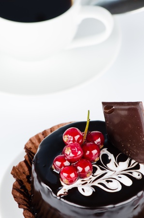 chocolate cake with redcurrants and coffee cupの写真素材