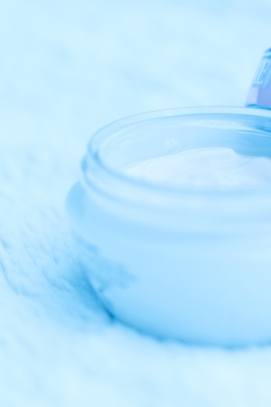 Cosmetic cream in an open jar with shallow depth of field