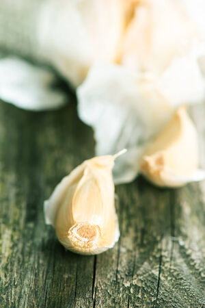Garlic on rustic wooden table