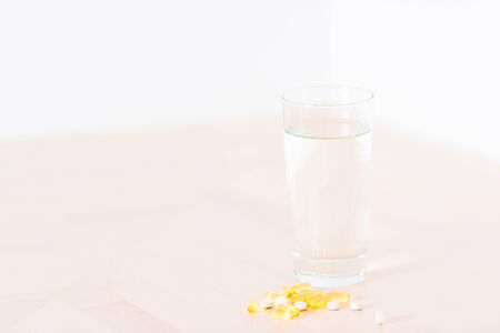 glass of water and pills with copy spaceの写真素材