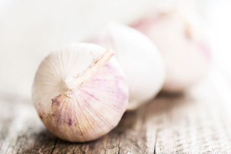 Garlic on rustic wooden tableの写真素材