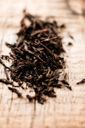 Black tea on woodの写真素材