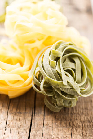 Italian pasta on wooden backgroundの写真素材