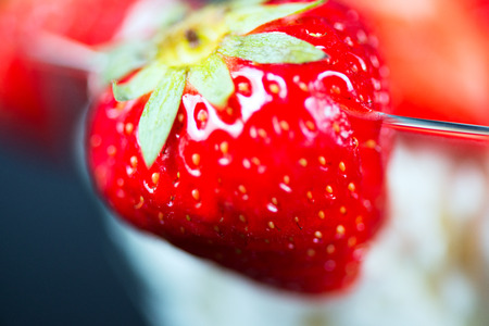 Strawberry and ice cream close upの写真素材