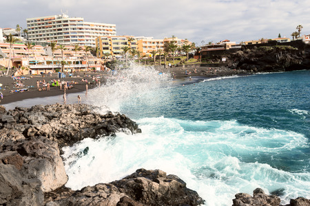 People at Black sand beach at Tenerife Island, Spainのeditorial素材