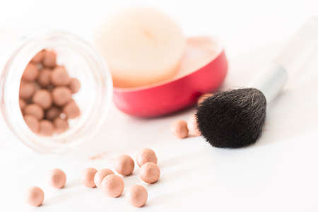 The bronzing pearls in jar and makeup brushの写真素材