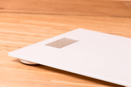 Scale on wooden floor