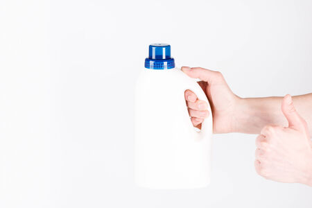 white plastic bottle on a white background with OK signの写真素材