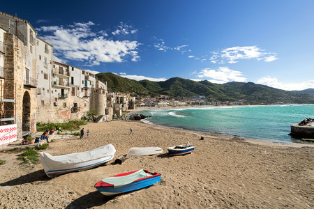 CEFALU, ITALY - APRIL 17, 2014: CEFALU, ITALY - AUGUST 23: Unidentified people at beach in Cefalu, Sicily, Italy. Cefalu is an attractive historic town and seaside resort.のeditorial素材