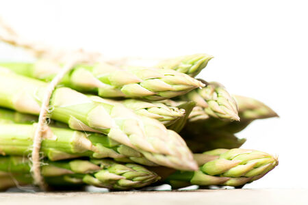 Asparagus on wooden tableの写真素材