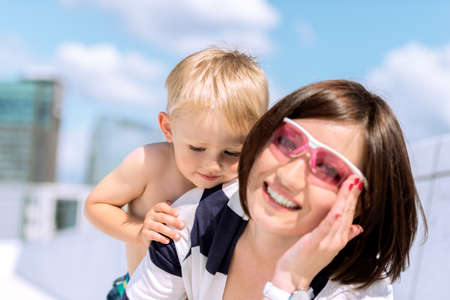 Lovely portrait of a mother and son outdoorの写真素材