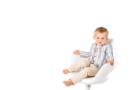 Boy in shirt shot in the studio on a white backgroundの写真素材