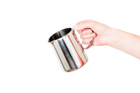 Stainless Steel Milk Boiler Jug in hand isolated on white backgroundの写真素材