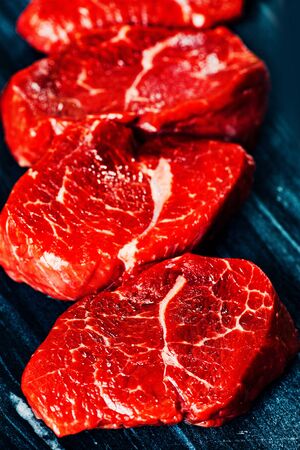 Beef steaks on cutting board close upの写真素材