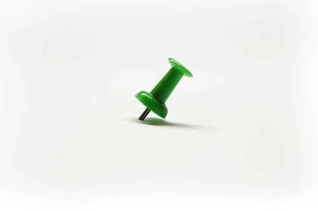 green drawing-pin on white background, isolatedの写真素材