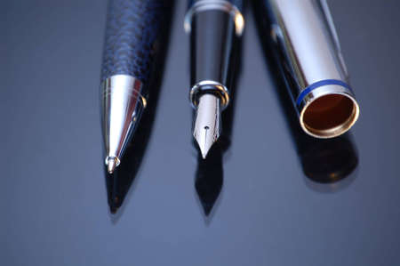 Classic nibbed fountain pen, on dark background.の写真素材