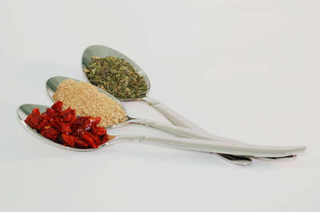 three spoons of colored aromatic spices  cooking