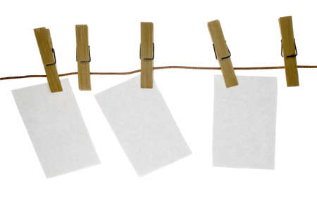 blank paper sheet on a clothes line. Isolated on white background.