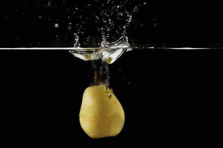 Splashing pear.Series of splashing fruitsの写真素材