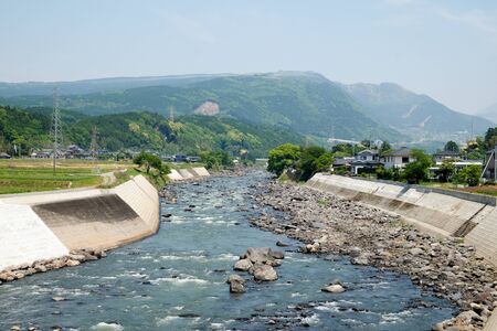 Close-up nature background of river, mountains,clear sky, blurred winds, cool weather during adventurous travel in Japan.の写真素材