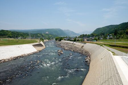 Close-up nature background of river, mountains,clear sky, blurred winds, cool weather during adventurous travel in Japan.の写真素材