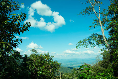 Beautiful landscape mountain view with green forest , blue sky and cloudy. The good travel for relax , the attractions in northern of Thailand.の写真素材