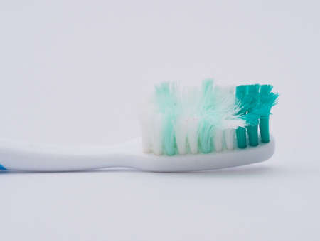 Macro photography of old toothbrush with frayed bristles