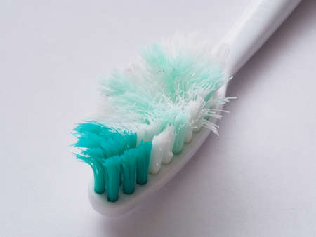 Macro photography of old toothbrush with frayed bristles