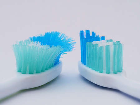 Comparison of the old and new toothbrushes in macro view, showing different bristle conditions