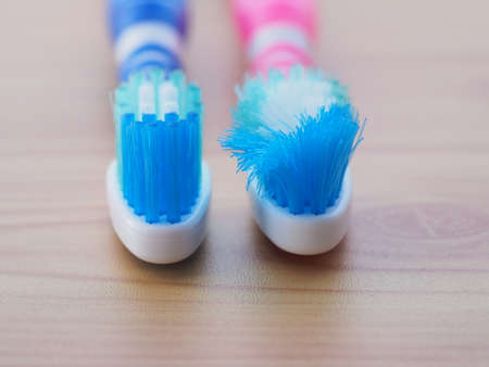 Comparison of the old and new toothbrushes showing different bristle conditions: time to change a...
