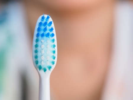 Close-up view of the straight bristles of a new toothbrush for oral hygieneの写真素材