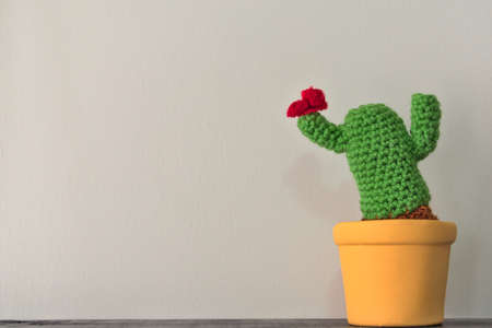 Crochet Cactus Red Wreath on yellow potの写真素材