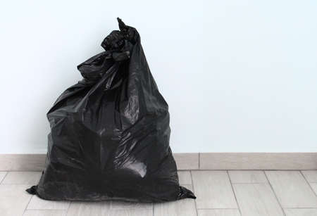 Black garbage bag full at homeの写真素材