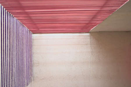 white background wall with entrance with pink top light and purple side lightの写真素材