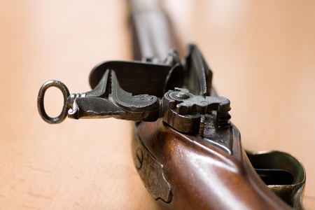 Cock, flint holder and pan of ancient flintlock rifleの写真素材