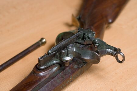 Antique rifle with flintlock mechanismの写真素材