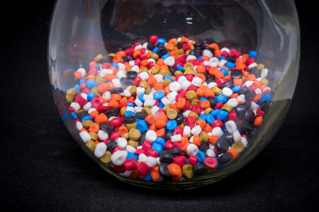 Mix Plastic pellets. Colorant for plastics In a glass bottleの写真素材