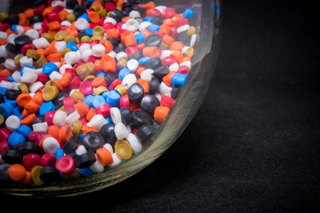 Mix Plastic pellets. Colorant for plastics In a glass bottleの写真素材