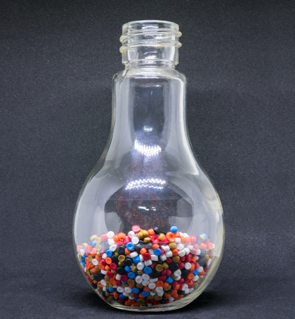 Mix Plastic pellets. Colorant for plastics In a glass bottleの写真素材