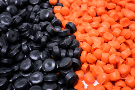 Black&Orange Plastic pellets. Colorant for plastics.