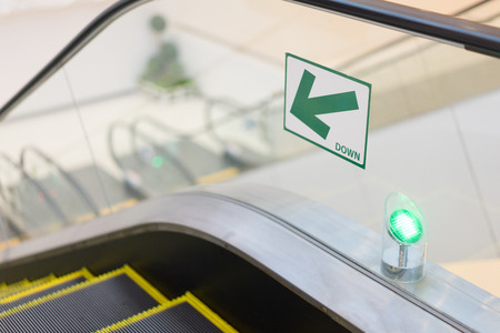 The way down of the escalator.