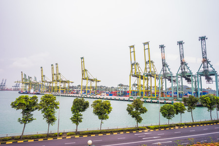 SINGAPORE CITY, SINGAPORE - February 2, 2018: View of container terminal at the Port of Singapore. Cargo ships docked in harbor.のeditorial素材