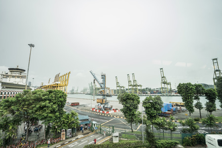 SINGAPORE CITY, SINGAPORE - February 2, 2018: View of container terminal at the Port of Singapore. Cargo ships docked in harbor.のeditorial素材